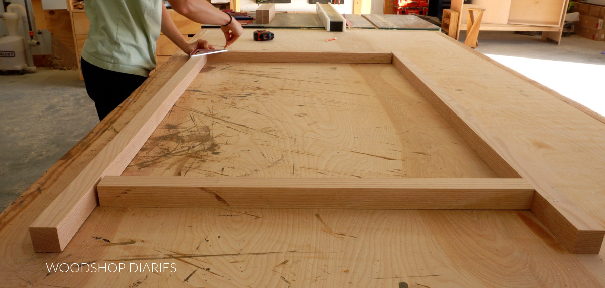 Shara Woodshop Diaries laying out and marking dowel holes on dresser frame