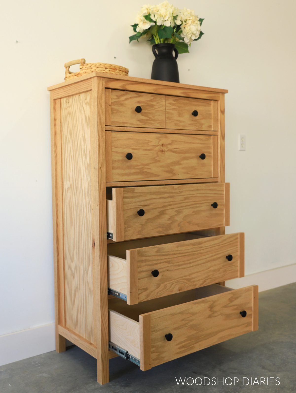 Completed DIY 6 drawer tall dresser with bottom three drawers open