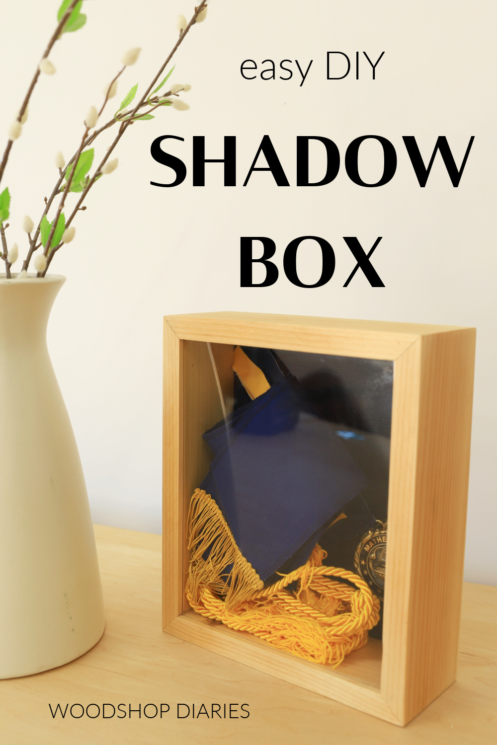 Pinterest image of DIY shadow box with text "easy DIY shadow box"