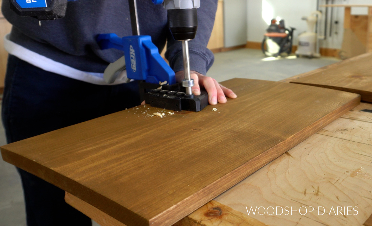 Shara Woodshop Diaries drilling dowel holes on face of 1x12 pin board with Kreg Dowel Jig