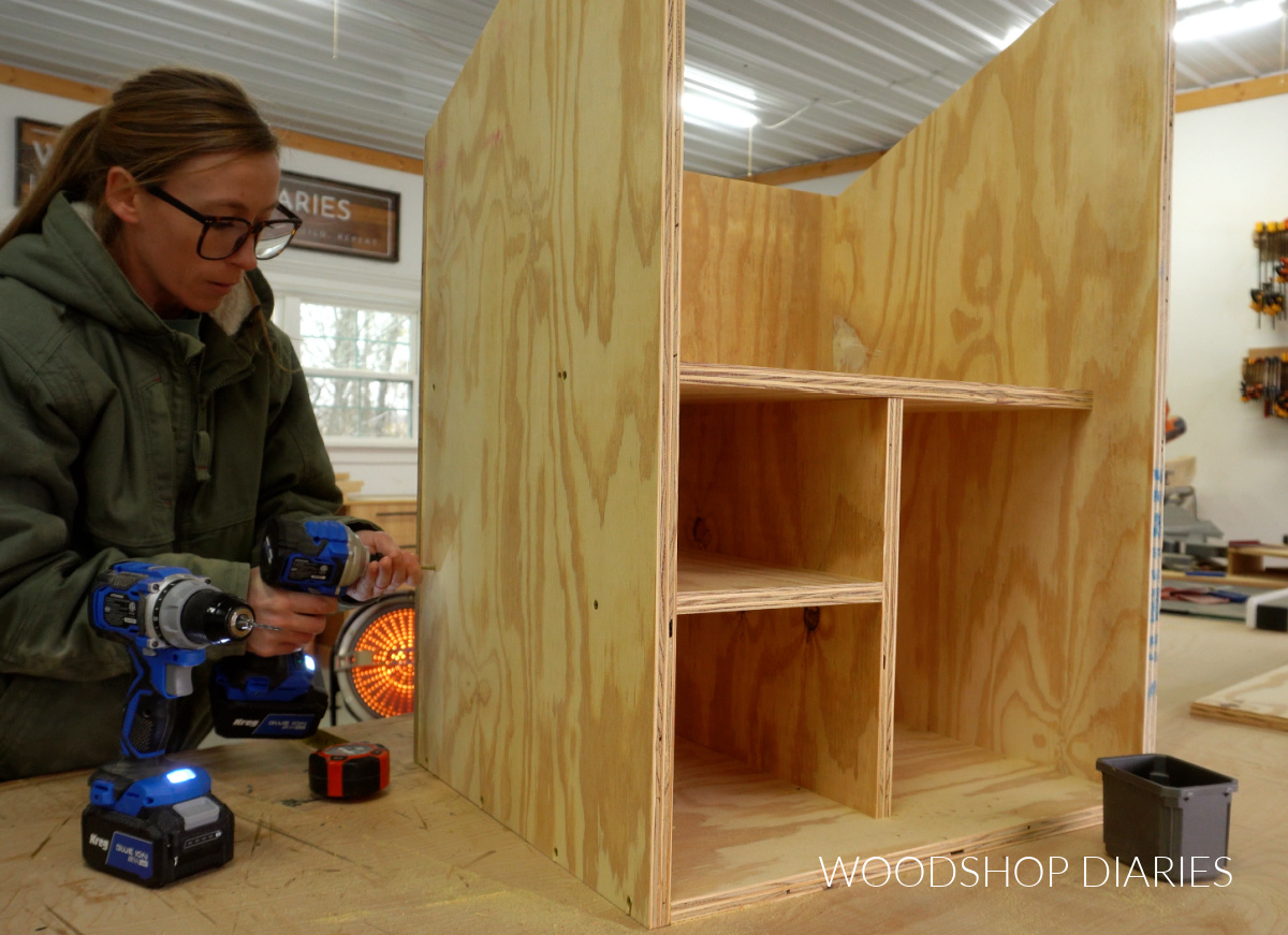 Shara Woodshop Diaries securing shelves into free little pantry box with screws through side panel