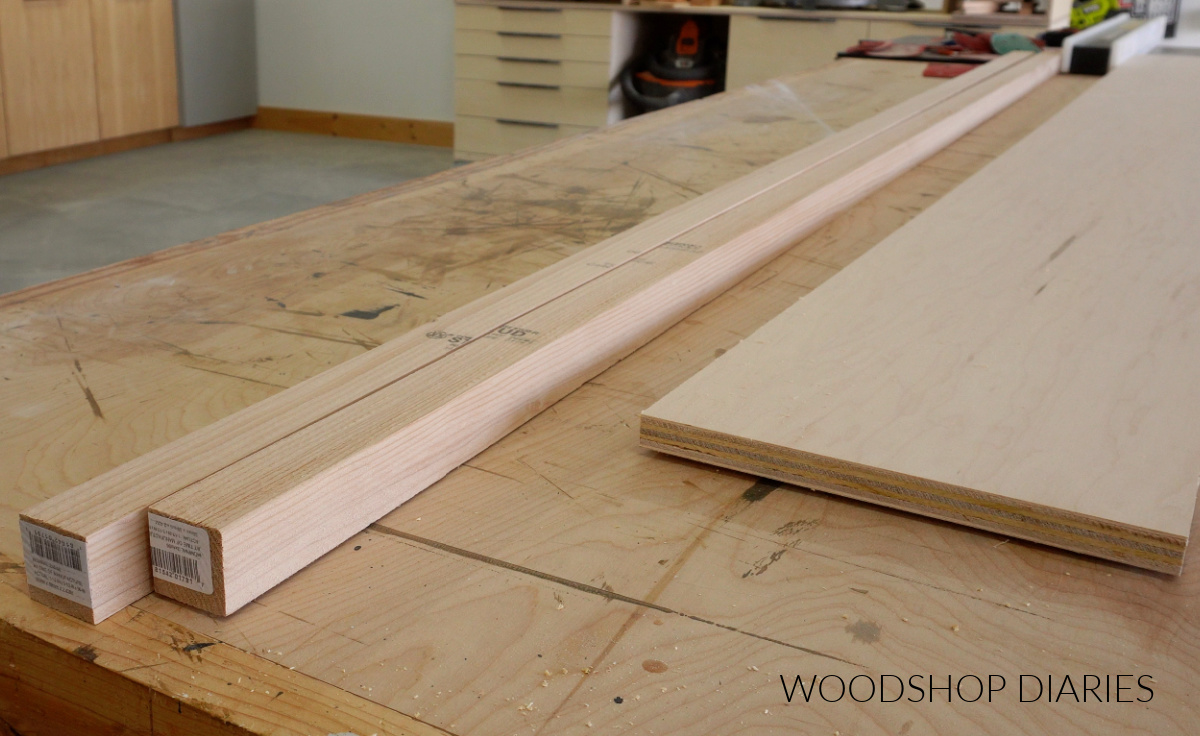 2x2 and plywood lumber to build bookcase laid out on workbench