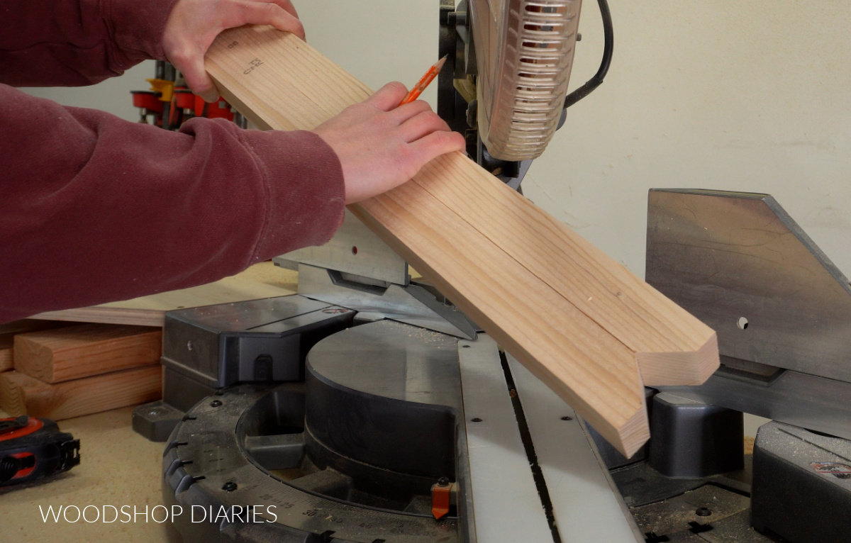 Close up of 2x2s at miter saw with tapered ends