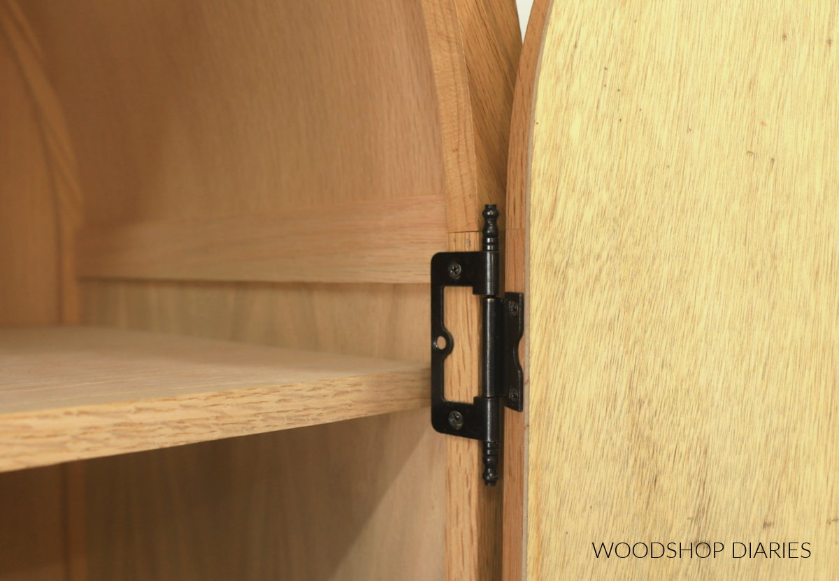 Close up of large cabinet butt hinges used to hand arched cabinet doors