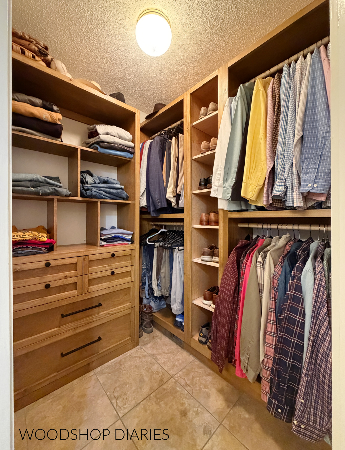 Walk in closet with built in wooden cabinets