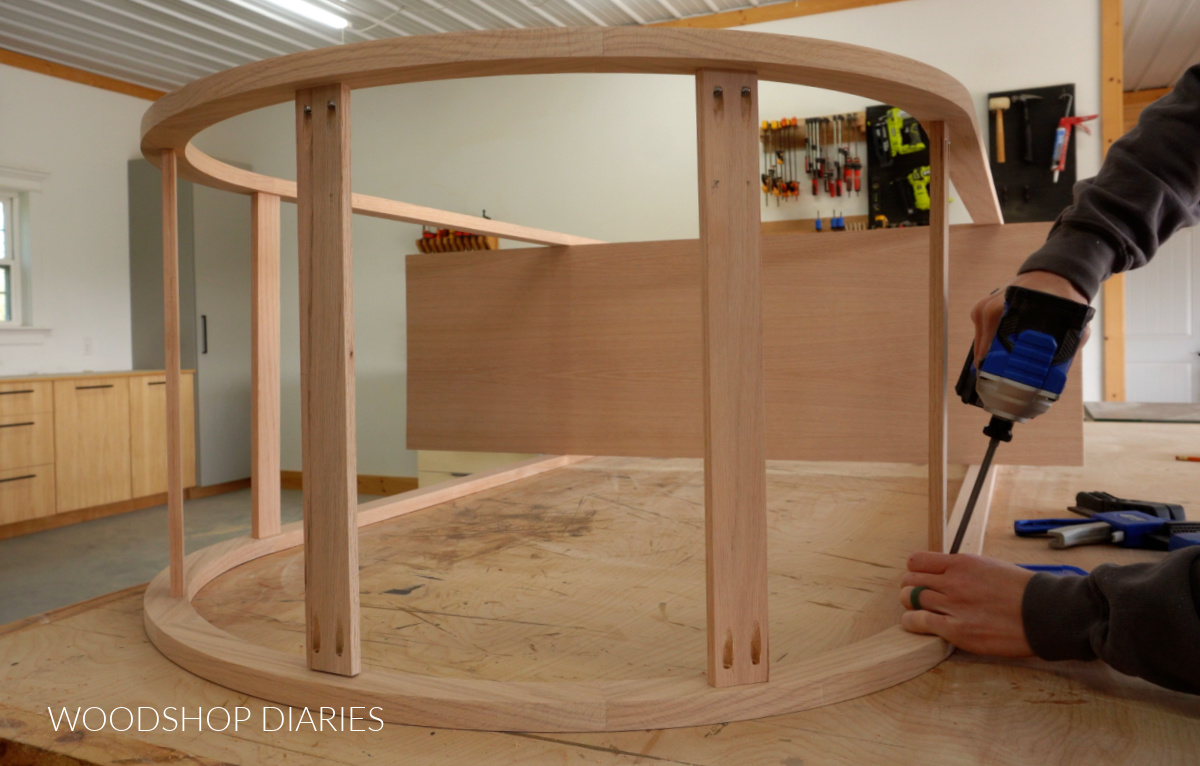 Shara Woodshop Diaries assembling arched cabinet frame supports around top with pocket holes