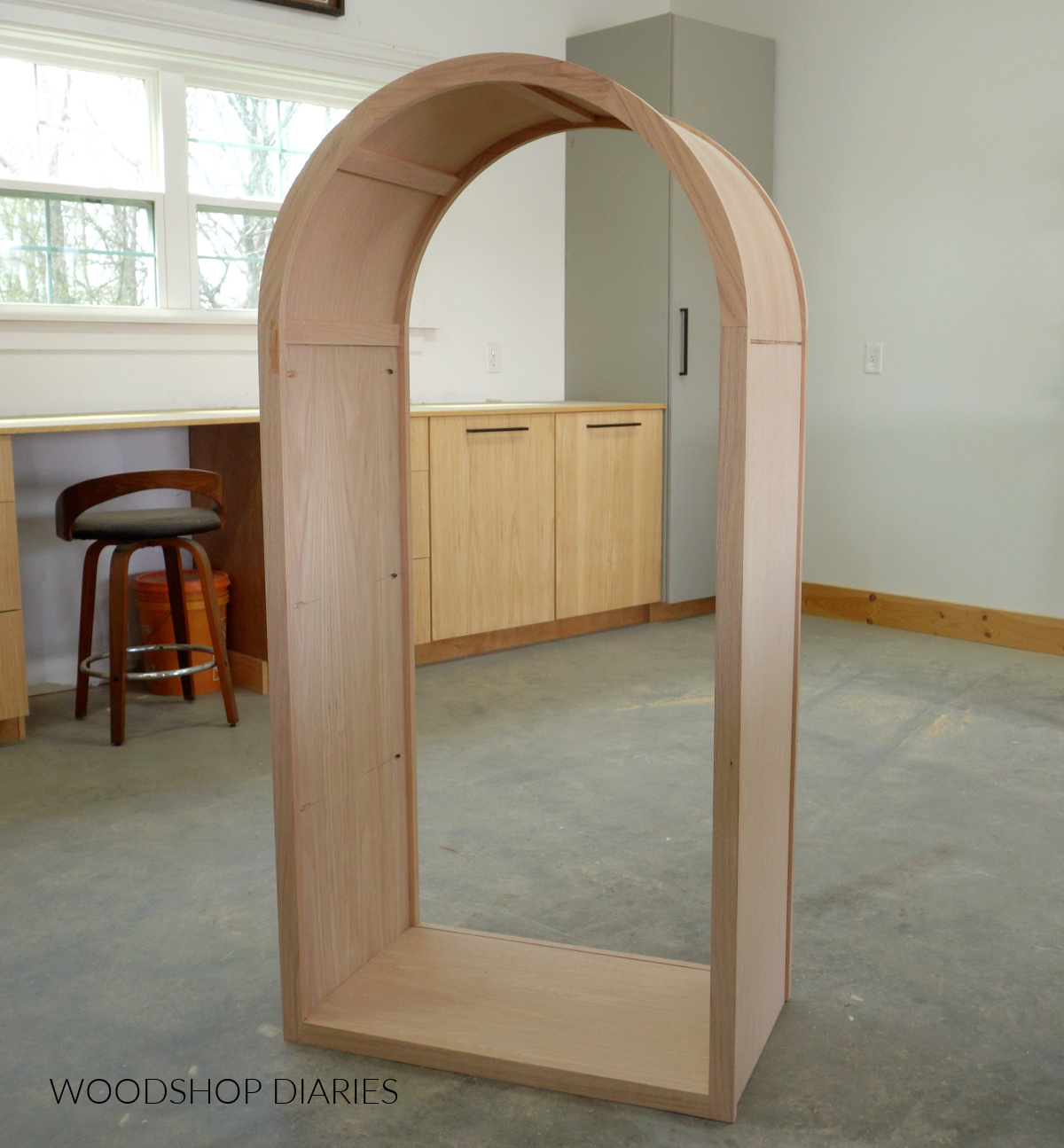Arched cabinet box assembled without back