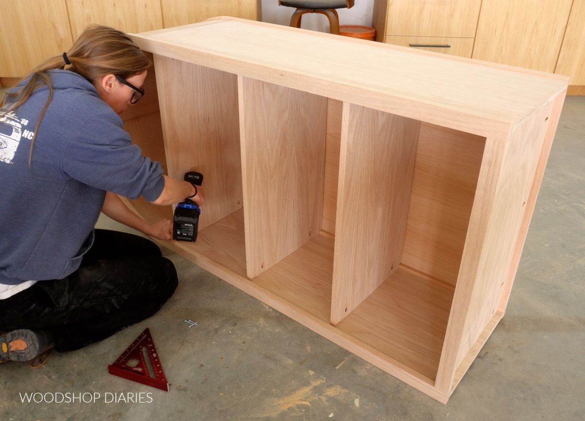 Shara Woodshop Diaries securing shelves into arched cabinet using pocket holes and screws