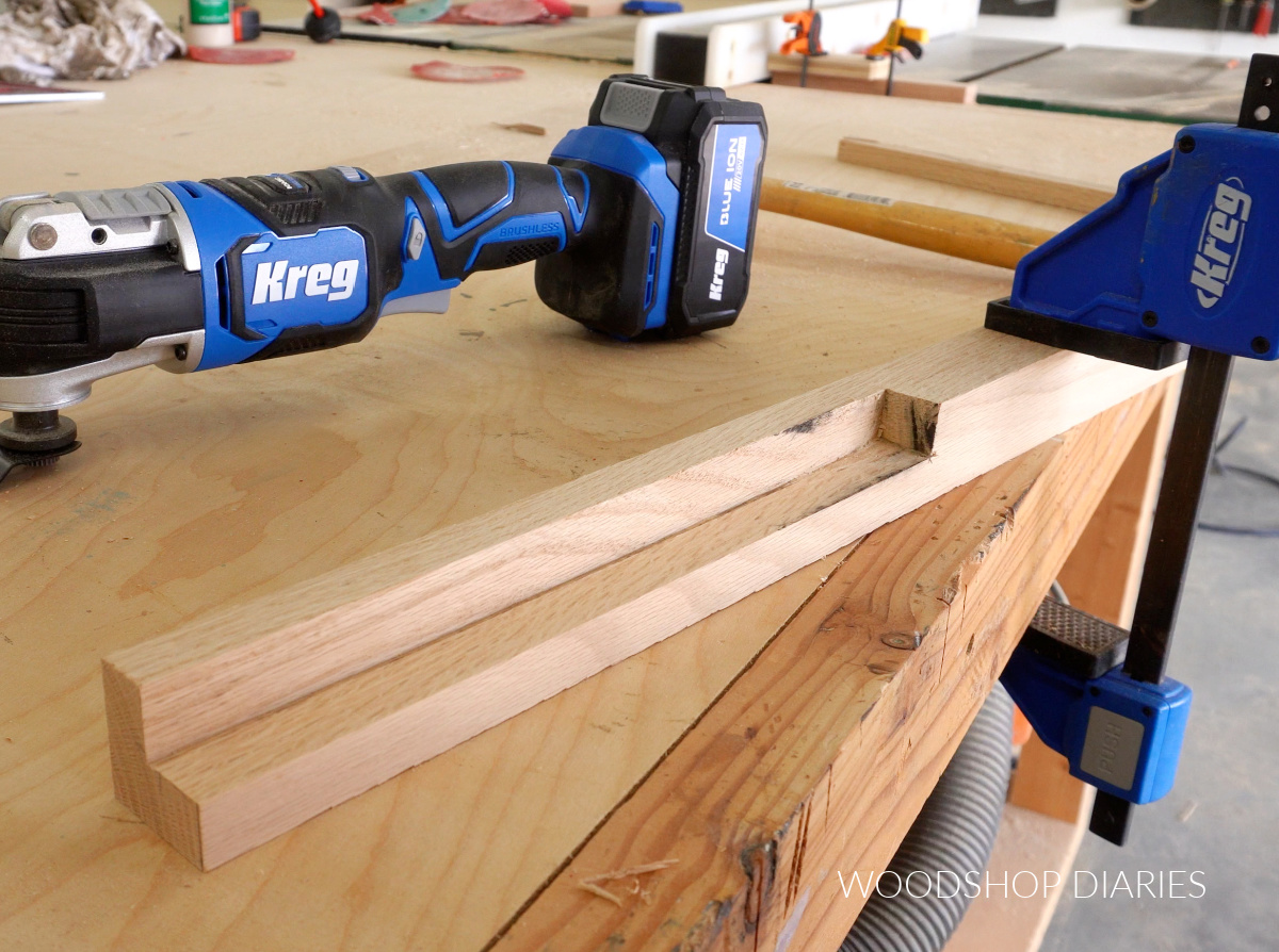 2x2 board with large notch to be used as legs on cabinet box